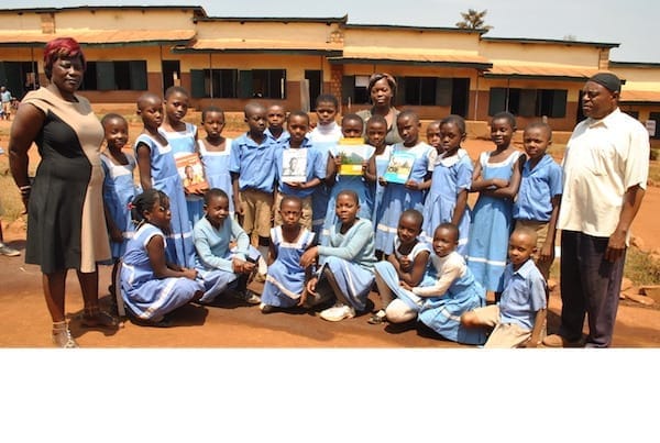 AZIRE-1 A photo of kids in front of a school in Bamenda.